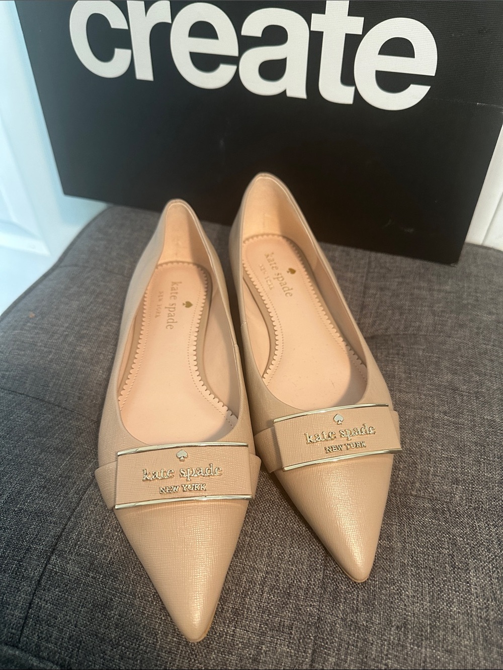 kate spade beige pointed-toe leather flats with gold logo plaque